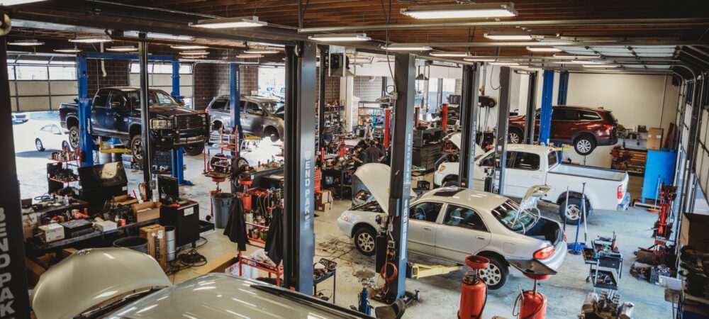 Jer’s Elite Automotive mechanic shop in Syracuse, Utah, **Alt Text:** *Jer’s Elite Automotive mechanic shop in Syracuse, Utah, providing expert auto repair and maintenance services. A busy garage with vehicles on lifts and technicians at work in Davis County.*